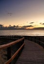 Wooden walkway to the beach at sunrise in Alicante, Spain Royalty Free Stock Photo