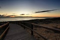 Wooden walkway to the beach at sunrise in Alicante, Spain Royalty Free Stock Photo