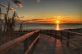 Wooden walkway to the beach at sunrise in Alicante, Spain Royalty Free Stock Photo