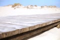 Wooden walkway to a beach. Wooden path on the sand dunes near a sea or ocean. Selective focus. Vacation concept Royalty Free Stock Photo