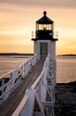 Wooden Walkway to Maine Lighthouse at Sunset Royalty Free Stock Photo