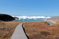 A wooden walkway towards Ilulissat Ice Fjord jakobshavn near Ilulissat in Summer Royalty Free Stock Photo