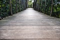 Wooden walkway, wood bridge through forest Royalty Free Stock Photo