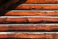 Wooden wall of a house made of thick logs Royalty Free Stock Photo