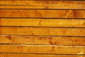 Wooden wall of natural cedar beams Royalty Free Stock Photo