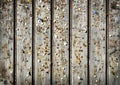 Wooden wall with old pins and staples. Vintage bulletin board. Royalty Free Stock Photo