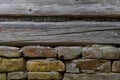 Wooden wall with a stone foundation