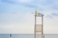 Wooden watchtower for lifeguards on the beach, in the background the sea and sky, the concept of rest