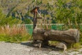 Wooden water fountain in the mountains of the alpine valleys Royalty Free Stock Photo