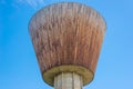 Wooden Water Tower, blue sky on background Royalty Free Stock Photo