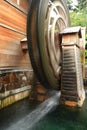 Wooden waterwheel is rotating Royalty Free Stock Photo