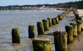 Wooden wave breakers in the sea Royalty Free Stock Photo