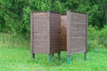 Wooden wear changing cabin near coniferous forest