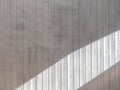 Wooden weatherboard painted white with a wide stripe of sunlight. Background and texture