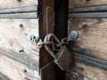 Wooden weathered antique gates closed with padlock Royalty Free Stock Photo