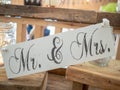 A wooden wedding decoration saying Mr & Mrs at a wedding venue