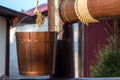 Wooden well. Bucket on a rope Royalty Free Stock Photo