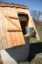 Wooden well with a bucket of water