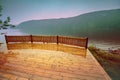 Wooden wet deck on a lakeshore Royalty Free Stock Photo