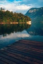 Wooden wharf pier at lake Bohinj in summer morning Royalty Free Stock Photo