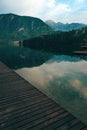 Wooden wharf pier at lake Bohinj in summer morning Royalty Free Stock Photo