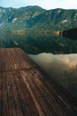 Wooden wharf pier at lake Bohinj in summer morning Royalty Free Stock Photo