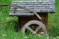 Wooden wheel of an ancient water mill Royalty Free Stock Photo