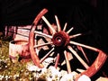 Wooden wheel from a cart. Decorative wheels for decorating lawns, exteriors and rustic interiors. Round homemade wheel