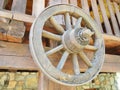 Wooden wheel from a cart. Decorative wheels for decorating lawns, exteriors and rustic interiors. A round homemade wheel