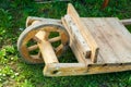 Wooden wheelbarrow with wooden wheel. traditional old transportation construction for transportation of stones in the middle ages