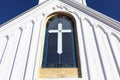 Wooden White Church Stained glass window with Cross, Blue Sky On Background. Christian Royalty Free Stock Photo