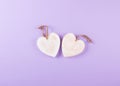 Wooden white hearts, rustic style, purple background, valentine`s day decor. Top view background.