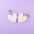 Wooden white hearts, rustic style, purple background, valentine`s day decor. Top view background.