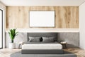 Wooden and white master bedroom with poster Royalty Free Stock Photo