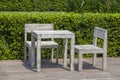 Wooden white table and chairs on a tropical beach cafe, Thailand. Holiday concept Royalty Free Stock Photo