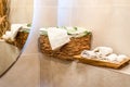 wooden wicker basket with towels on wooden shelf for bathroom Royalty Free Stock Photo