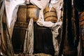 Wooden winch of a sailing ship and ropes on the deck of medieval pirate warship Royalty Free Stock Photo