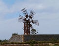 A wooden wind mill with six wings