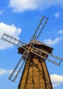 Wooden windmill against the sky