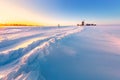 Wooden windmill on background winter sunrise. Dudutki village, Belarus Royalty Free Stock Photo