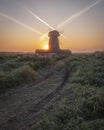 windmill in the countryside at dawn in autumn, in the morning of the first frost Royalty Free Stock Photo