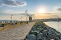 The wooden windmill on the isthmus at sunrise in Nessebar ancient city on the Bulgarian Black Sea Coast. Nesebar or Nesebr is a Royalty Free Stock Photo