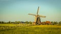 Wooden windmill with miller house vintage look
