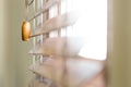 Wooden window blinds partially closed with bright light Royalty Free Stock Photo