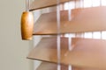 Wooden window blinds partially closed with bright light Royalty Free Stock Photo