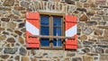Wooden window in colors of Austrian flag red, white of tourist mountain hut Wolfsbergerhuette Wolfsberg cottage, Saualpe Royalty Free Stock Photo