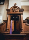 Wooden window of confessional box at church Royalty Free Stock Photo