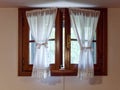 Wooden window with curtains of an italian house Royalty Free Stock Photo