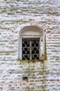 Wooden window with a forged grate in an old church Royalty Free Stock Photo