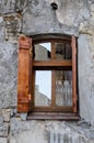 Wooden window on an old degraded wall Royalty Free Stock Photo